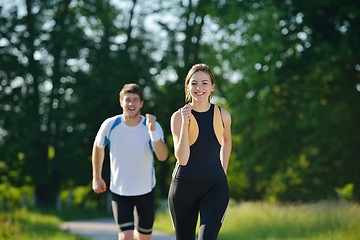 Image showing Young couple jogging at morning