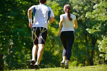 Image showing Young couple jogging