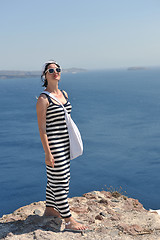 Image showing Greek woman on the streets of Oia, Santorini, Greece