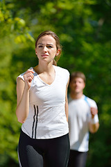 Image showing Young couple jogging