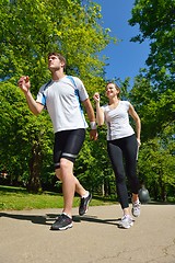 Image showing Young couple jogging