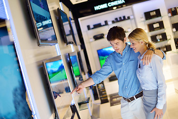 Image showing Young couple in consumer electronics store