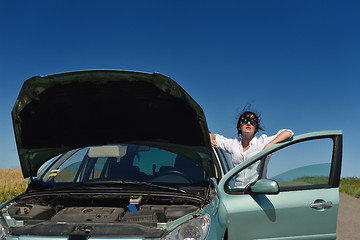 Image showing woman with broken car