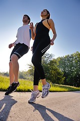 Image showing Young couple jogging