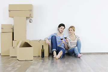 Image showing Young couple moving in new home