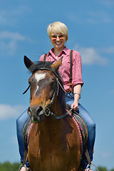 Image showing happy woman  on  horse