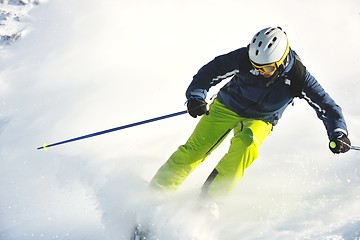 Image showing skiing on fresh snow at winter season at beautiful sunny day