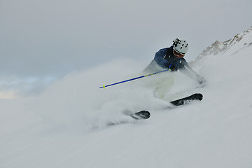 Image showing skiing on fresh snow at winter season at beautiful sunny day