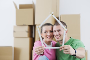 Image showing Young couple moving in new house