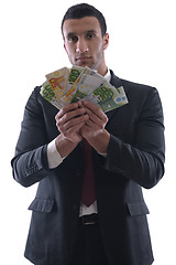 Image showing Business man holding money