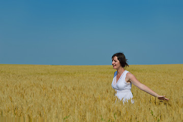 Image showing young woman in wheat field at summer