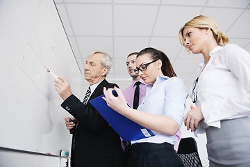 Image showing Senior business man giving a presentation