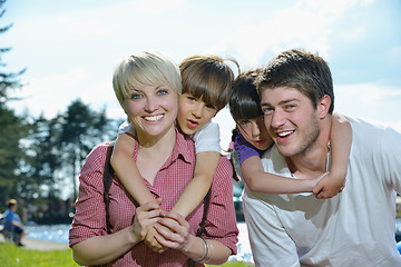 Image showing happy young family have fun outdoors