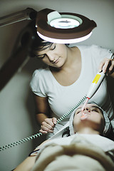 Image showing woman with facial mask in cosmetic studio