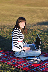 Image showing young teen girl work on laptop outdoor