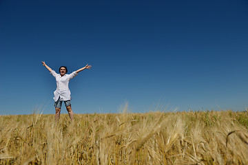 Image showing young woman in wheat field at summer