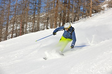 Image showing skiing on fresh snow at winter season at beautiful sunny day