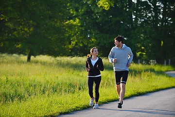 Image showing Young couple jogging