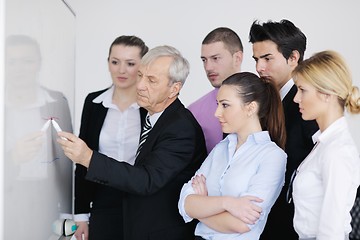 Image showing Senior business man giving a presentation