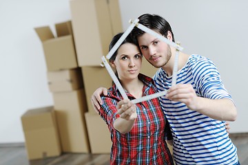 Image showing Young couple moving in new house