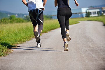 Image showing Young couple jogging