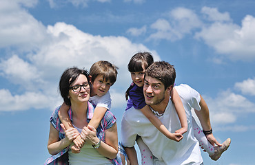 Image showing happy young family have fun outdoors