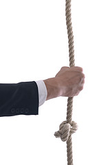 Image showing business man with rope isolated on white background