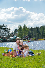 Image showing Happy family playing together in a picnic outdoors