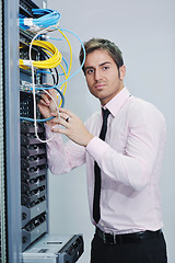 Image showing young it engineer in datacenter server room