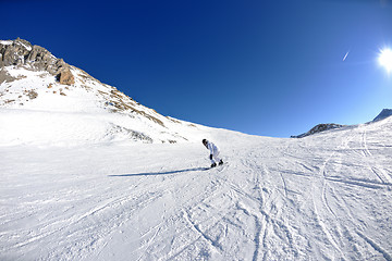 Image showing skiing on fresh snow at winter season at beautiful sunny day