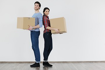 Image showing Young couple moving in new home