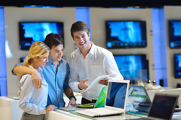 Image showing Young couple in consumer electronics store