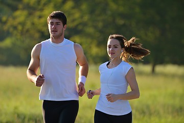 Image showing Young couple jogging