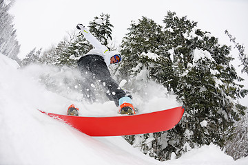 Image showing snowboarder on fresh deep snow