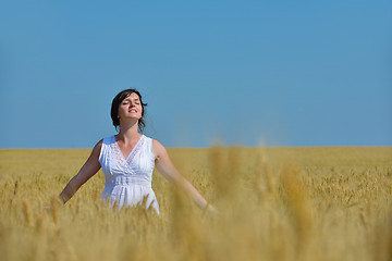 Image showing young woman in wheat field at summer