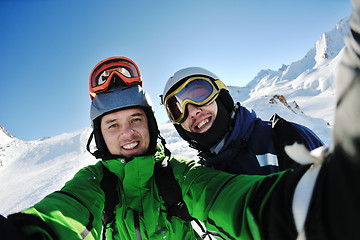 Image showing winter portrait of friends at skiing