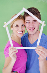 Image showing happy couple paint wall at new home