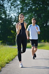 Image showing Young couple jogging at morning