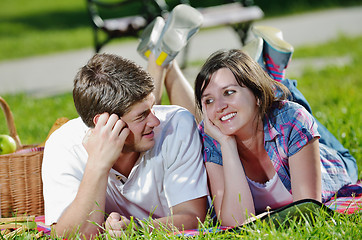 Image showing happy young couple having a picnic outdoor