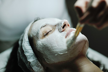 Image showing woman with facial mask in cosmetic studio