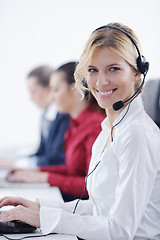 Image showing business woman group with headphones