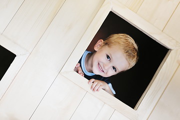 Image showing happy child in a window