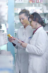 Image showing team of pharmacist chemist woman  in pharmacy drugstore