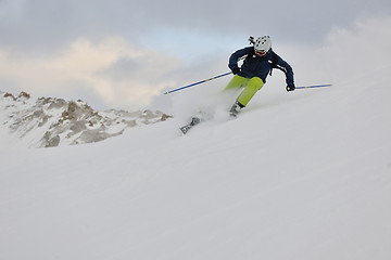 Image showing skiing on fresh snow at winter season at beautiful sunny day