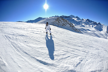 Image showing skiing on fresh snow at winter season at beautiful sunny day