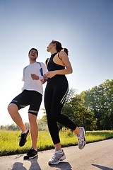 Image showing Young couple jogging