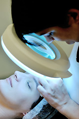 Image showing woman with facial mask in cosmetic studio