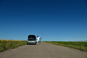 Image showing woman with broken car