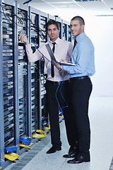 Image showing it enineers in network server room