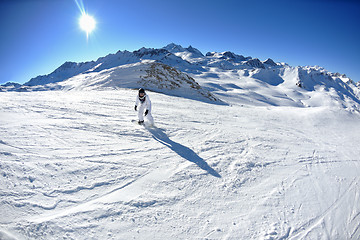 Image showing skiing on fresh snow at winter season at beautiful sunny day